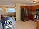 Spacious kitchen features stainless steel appliances, granite countertops and tile flooring at 13122 Cumberland Dr, Largo, FL 33773