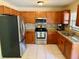 Well-equipped kitchen featuring stainless steel appliances, granite countertops, and plenty of cabinet storage space at 13122 Cumberland Dr, Largo, FL 33773