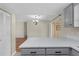 Kitchen featuring sleek countertops and stainless steel appliances overlooking the living area at 1904 Crown Park Dr, Valrico, FL 33594