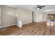 Open-concept living space with hardwood floors, ceiling fan, and sliding glass doors at 1904 Crown Park Dr, Valrico, FL 33594