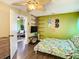 Bright bedroom with a unique ceiling fan, decorative hats, and a cozy bed at 2904 Sanchez St, Tampa, FL 33605