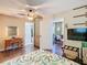 Bedroom features a tropical themed bedspread, hardwood floors and modern decor at 2904 Sanchez St, Tampa, FL 33605