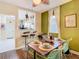 Inviting dining room with a view into the kitchen and stylish decor at 2904 Sanchez St, Tampa, FL 33605