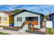 Charming single-story home featuring a cozy front porch with a wooden railing and fresh landscaping at 2904 Sanchez St, Tampa, FL 33605