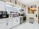 Modern kitchen features white cabinetry, stainless steel appliances, and a bright, airy layout at 2904 Sanchez St, Tampa, FL 33605