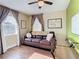 Comfortable living room with hard wood floors, modern fan and view from the window at 2904 Sanchez St, Tampa, FL 33605