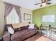 The living room features a comfortable leather sofa, decorative curtains, and a ceiling fan at 2904 Sanchez St, Tampa, FL 33605