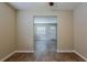 Bright dining area with wood-look flooring and view into the living room at 4812 N 37Th St, Tampa, FL 33610