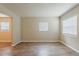 Inviting living area with wood-look flooring and ample natural light from multiple windows at 4812 N 37Th St, Tampa, FL 33610