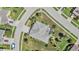 Aerial view of home showcasing the roof, screened-in lanai, landscaping, and neighborhood at 8721 Crystal Creek Ct, Land O Lakes, FL 34638