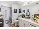 Bathroom featuring modern fixtures, decorative elements, and a glass door to the shower at 8721 Crystal Creek Ct, Land O Lakes, FL 34638