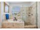 Luxurious bathroom featuring a soaking tub, tiled walk-in shower, and natural light, perfect for relaxation at 8721 Crystal Creek Ct, Land O Lakes, FL 34638