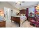 Cozy bedroom features a traditional style bed, wood furnishings, neutral walls and a ceiling fan at 8721 Crystal Creek Ct, Land O Lakes, FL 34638