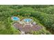 Aerial shot showcasing the extensive community pool, clubhouse, and surrounding lush greenery at 8721 Crystal Creek Ct, Land O Lakes, FL 34638