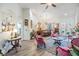 Open-concept living space featuring hard surface floors, bright natural light, and an ornate dining set at 8721 Crystal Creek Ct, Land O Lakes, FL 34638