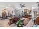 Spacious living area featuring stylish decor, hardwood floors, and access to the outdoor patio at 8721 Crystal Creek Ct, Land O Lakes, FL 34638