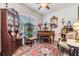 Charming living room with antique furnishings, including a piano and ornate mirror, exudes vintage elegance at 8721 Crystal Creek Ct, Land O Lakes, FL 34638
