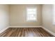 Comfortable bedroom with a window providing natural light and wood flooring at 1424 14Th S St, St Petersburg, FL 33705