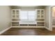 Dining room featuring hardwood floors, built-in shelving, window seat, and plenty of natural light at 1424 14Th S St, St Petersburg, FL 33705