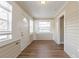 Charming entryway with natural light, wood floors, and neutral-toned walls leading into other rooms at 1424 14Th S St, St Petersburg, FL 33705