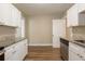 Bright kitchen featuring granite countertops, stainless steel dishwasher, and modern cabinetry at 1424 14Th S St, St Petersburg, FL 33705