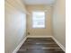 Functional laundry room with a window, overhead shelving, and neutral paint at 1424 14Th S St, St Petersburg, FL 33705
