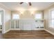 Spacious living room with a decorative white brick fireplace and built-in shelving at 1424 14Th S St, St Petersburg, FL 33705