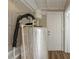 Compact utility room features modern flooring, insulated water tank, and access to outdoor space at 1424 14Th S St, St Petersburg, FL 33705