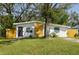 Charming single-story home with a well-maintained lawn and inviting front entrance at 2356 Kingston S St, St Petersburg, FL 33711