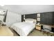Bright main bedroom with stylish furniture and a comfortable bed at 2356 Kingston S St, St Petersburg, FL 33711