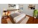 Tastefully decorated bedroom featuring neutral colors, comfortable bedding, and natural light at 2936 Banyan Hill Ln, Land O Lakes, FL 34639