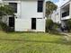 Backyard featuring a white fence and grassy yard at 738 Haven Pl, Tarpon Springs, FL 34689