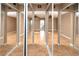 Bedroom includes wood floors, neutral paint and a large mirrored closet at 738 Haven Pl, Tarpon Springs, FL 34689