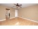 The bedroom features wood floors, neutral paint and a ceiling fan at 738 Haven Pl, Tarpon Springs, FL 34689