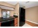Kitchen with granite counters and black refrigerator at 738 Haven Pl, Tarpon Springs, FL 34689