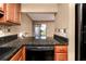 Kitchen with granite counters and stainless dishwasher at 738 Haven Pl, Tarpon Springs, FL 34689