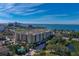 Stunning aerial view of a modern apartment building overlooking the bay and city skyline at 1064 N Tamiami Trl # 1219, Sarasota, FL 34236