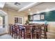 Enjoy a modern bar area complete with ample seating, sleek countertops, and tasteful decor for entertaining at 1064 N Tamiami Trl # 1219, Sarasota, FL 34236