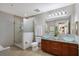 Bright bathroom with walk-in shower, dual bowl vanity, and modern fixtures at 1064 N Tamiami Trl # 1219, Sarasota, FL 34236