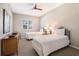 Well lit bedroom featuring two twin beds, neutral decor and ceiling fan at 1064 N Tamiami Trl # 1219, Sarasota, FL 34236