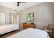Bedroom with two twin beds, overhead fan, carpet and closet at 1064 N Tamiami Trl # 1219, Sarasota, FL 34236