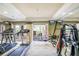 Well-equipped gym with treadmills, weight machines, and access to outdoor seating area at 1064 N Tamiami Trl # 1219, Sarasota, FL 34236