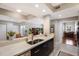 Kitchen counter featuring stainless steel sink and faucet overlooking additional living spaces at 1064 N Tamiami Trl # 1219, Sarasota, FL 34236