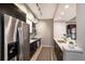 Well-equipped kitchen with stainless steel appliances, sleek cabinetry, and a modern backsplash at 1064 N Tamiami Trl # 1219, Sarasota, FL 34236