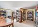 Spacious library with bookshelves and sitting area creating a comfortable reading environment at 1064 N Tamiami Trl # 1219, Sarasota, FL 34236