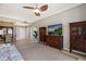Living room featuring tile flooring, a ceiling fan, and comfortable seating arrangement, perfect for relaxation and entertainment at 1064 N Tamiami Trl # 1219, Sarasota, FL 34236