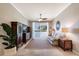 Inviting living room space with a sliding glass door, natural light, neutral tones, and tiled flooring at 1064 N Tamiami Trl # 1219, Sarasota, FL 34236