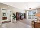 Bright living room featuring neutral walls, tile floors, balcony, and decorative built-in shelving at 1064 N Tamiami Trl # 1219, Sarasota, FL 34236