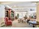 Cozy lounge area featuring a large entertainment center, comfortable seating, and elegant decor at 1064 N Tamiami Trl # 1219, Sarasota, FL 34236