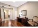 Office space featuring a desk and chair, hardwood floors and an open doorway at 1064 N Tamiami Trl # 1219, Sarasota, FL 34236